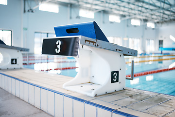 Image showing Start, platform and water sports with block at swimming pool for championship, jumping and race. Fitness, competition and wellness with lane in indoor arena for exercise, workout and training