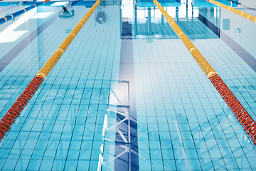 Image showing Swimming, lane and water at an indoor pool for sports, recreation and weekend fun. Empty, training and a rows for competition, sport race or practice cardio for athletes or leisure activities