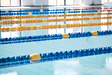 Image showing Empty, swimming pool or lines in water for race or racing lanes for fitness or underwater sports. Background, blue or gym training arena ready for cardio performance, workout or exercise challenge