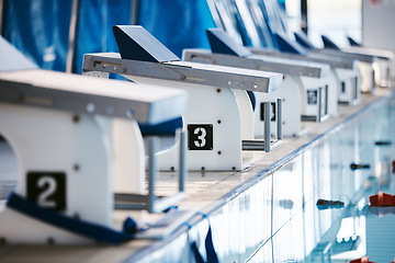 Image showing Start, platform and swimming with block at pool for championship, jumping and race. Fitness, competition and wellness with lane in indoor arena for exercise, workout and water sports training