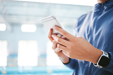 Image showing Phone, hands and athlete texting at swimming pool for social media, web scrolling or online browsing after exercise. Swim sports, cellphone and woman typing on internet chat after workout or training