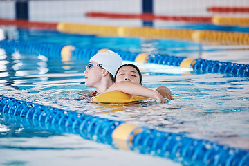 Image showing Swimming pool rescue, or woman with lifeguard for emergency, drowning accident or dangerous activity. Fitness training, breathing or strong person saving life of girl swimmer or victim in water