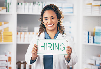 Image showing Pharmacist woman, smile and poster in portrait for hiring, job and opportunity in healthcare store. Pharmacy, small business owner and paper for recruitment, onboarding and announcement for medicine