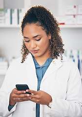 Image showing Pharmacist woman, phone and texting in store for contact, email communication or reading chat. Pharmacy, female and smartphone for social media app, typing and medical news on internet in workplace