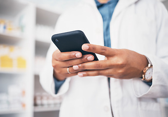 Image showing Hands, phone and medicine with a pharmacist woman at work in a drugstore or dispensary for communication. Pharmacy, mobile or contact with a female professional in healthcare working at an apothecary