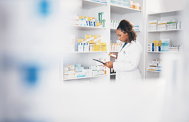 Image showing Tablet, stock and medicine with a woman in a pharmacy to fill an online order of prescription treatment. Medical, product or insurance with a female pharmacist working as a professional in healthcare