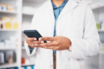 Image showing Hands, phone and medical with a pharmacist woman at work in a drugstore for healthcare or communication. Pharmacy, mobile and contact with a female medicine professional working in a dispensary