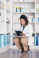 Image showing Pharmacy, focus and pharmacist woman on tablet for medicine management, stock research or inventory. Digital, product logistics and retail or medical doctor, checklist and pharmaceutical folder check