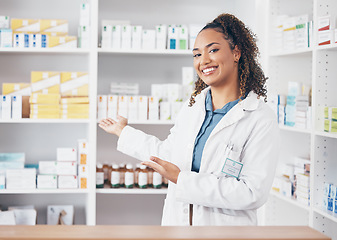 Image showing Pharmacist woman, portrait and counter help, choice or show medicine stock, product and happy customer service. Biracial doctor, medical professional and pharmacy, healthcare advice of drugs on shelf