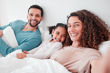 Image showing Selfie, bedroom and portrait of parents with girl in bed relax for quality time, bonding and love in morning. Family home, face and happy mother, father and child smile for picture, post and memory