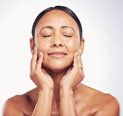 Image showing Old woman, face and antiaging skincare, beauty and dermatology with natural cosmetics isolated on studio background. Female eyes closed, satisfaction and wellness with cosmetic care and skin glow