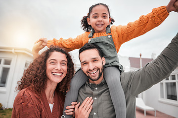 Image showing Family portrait, piggy back and happy man, woman and child in yard of new house, happiness and security at home. Interracial mother, father and girl bonding in backyard together with love and smile.