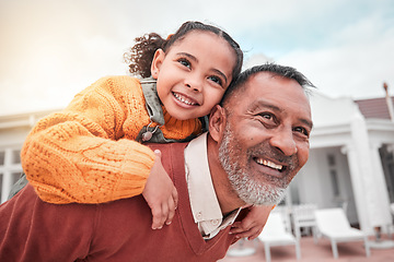 Image showing Smile, piggy back and grandfather with child in yard of house, happiness and security at family home. Relax, happy old man and girl bonding in backyard together with love and outdoor fun on weekend.