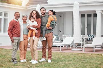 Image showing Family, generations and happiness in portrait at holiday home, grandparents and parents with children on lawn. Men, women and kids, love and care in relationship and happy people smile on vacation