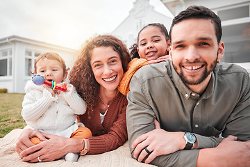 Image showing Relax, picnic and portrait of a happy family bonding outside a house feeling excited and happiness. Smile, interracial and mother with children, kids and father with care together on vacation