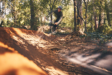 Image showing Bike, fitness and motion blur with a man in the forest for cycling, adventure or freedom in nature. Bicycle, exercise and a male athlete cyclist outdoor in the woods for cardio or endurance training