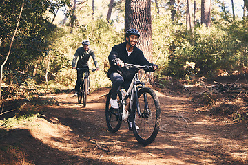 Image showing Forest, fitness and friends cyclist on bicycle in nature with helmet, exercise adventure trail and health mindset. Cycling, woods and man with mountain bike in trees for workout, motivation or energy