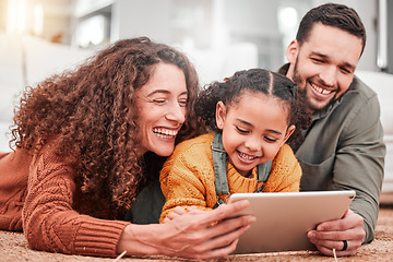 Image showing Happy family on floor with tablet, kid and movies, streaming service for child development video for education. Mom, dad and girl on carpet, happiness and smile, digital entertainment in living room.