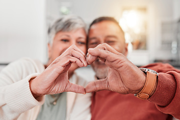 Image showing Couple, senior and heart hands in home, love and bonding in retirement together. Romance, hand gesture and elderly man and woman with emoji for care, affection and empathy, commitment and trust.