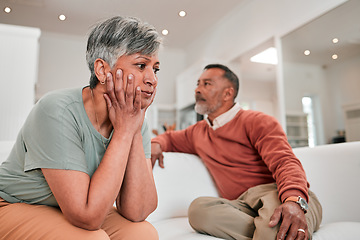 Image showing Divorce, stress and senior couple in home living room on sofa with conflict, infidelity or cheating. Retirement, elderly and man and woman fighting, sad or depressed with marriage problem or thinking