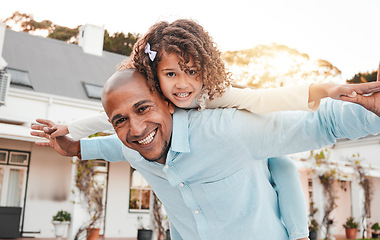 Image showing Family, portrait and father with girl in piggyback game, home garden bonding and quality time playing. Love, flying and happy dad carrying child with smile on summer vacation, weekend and holiday