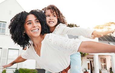 Image showing Play, flying or mother with girl on back in home garden bonding, quality time and playing outdoors. Love, airplane and happy mom piggyback with child on summer vacation, weekend or backyard holiday