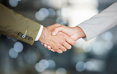 Image showing Business people, handshake and partnership, agreement or welcome with deal, onboarding and thank you. Collaboration, professional and team shaking hands on blurred background bokeh in b2b solidarity