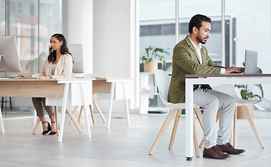 Image showing Office, workspace and business people in startup typing on computer, digital marketing or coworking in building. Professional employees or man and woman working on laptop and desktop for productivity