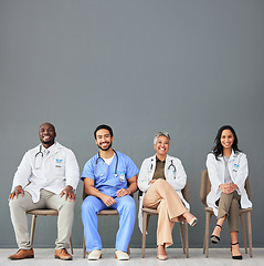 Image showing Healthcare, doctors and portrait of team on chair on wall background for insurance, wellness and medical mockup. Hospital, teamwork and men and women sitting in line for consulting, help and service