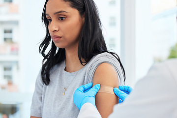 Image showing Scared woman, arm and covid with a plaster and doctor for healthcare and medical injection on arm. Female patient at a clinic or hospital for a vaccine with a bandage for virus, health and wellness