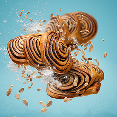 Image showing Sweet rolls with cinnamon and cocoa filling