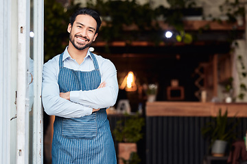 Image showing Happy asian man, portrait and arms crossed in small business at restaurant for welcome, service or job at door. Male entrepreneur smile in confidence at entrance ready to serve in coffee shop or cafe