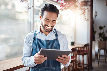 Image showing Restaurant, tablet and happy man or small business owner, e commerce and online cafe or coffee shop management. Waiter or asian person reading sales on digital technology or internet for his startup