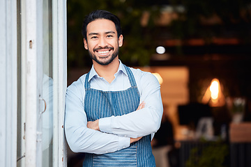 Image showing Asian man, portrait smile and arms crossed in small business at restaurant for welcome, service or job at door. Happy male entrepreneur in confidence at entrance ready to serve in coffee shop or cafe