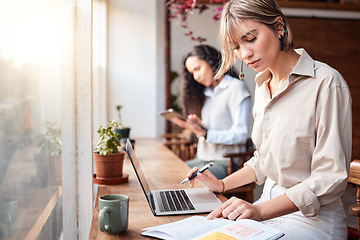 Image showing Cafe, writing and planning women on laptop for remote work, online business or internet project with notebook. Focus, serious and customer or person coworking in coffee shop with computer research