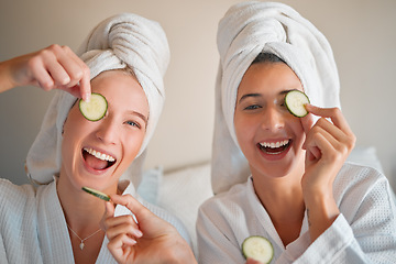 Image showing Friends, cucumber and teenager, girl and facial, happy with pampering and beauty in portrait with skincare treatment. Happiness, people have fun together and female friendship, cosmetics and laughter