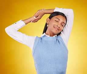 Image showing Relax, stretching and a woman on a yellow background in studio for peace, quiet or free time. Freedom, sleepy or lifestyle and an attractive young female posing with her eyes closed for a stretch