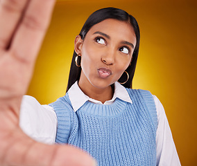 Image showing Selfie, happy woman and kiss in studio isolated on a brown background or backdrop. Thinking, idea and Indian person taking photo for memory, social media or profile picture for photography pout.