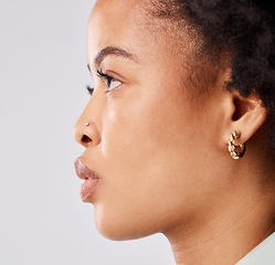 Image showing Serious, side profile and face of a black woman isolated on a white background in a studio. Focus, thinking and an African girl looking thoughtful, contemplating and taking a headshot on a backdrop