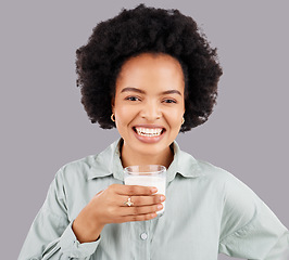 Image showing Portrait, woman and smile with milk in studio, white background and backdrop for healthy diet. Female model, glass and calcium of smoothie, vanilla milkshake and nutrition of detox weight loss drink