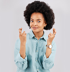 Image showing Luck, woman portrait and hands and fingers crossed with hope and in a studio. Isolated, gray background and young female model with surprise face and emoji hand sign hopeful and waiting for win