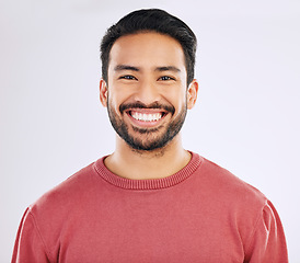 Image showing Happy, handsome and a headshot portrait of an Asian man isolated on a white background in studio. Smile, pride and a guy with confidence, happiness and attractive while smiling on a backdrop