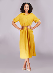 Image showing Smile, woman and portrait in studio, fashion and background with style, confidence or happiness. Happy female model posing in yellow dress, positive attitude and empowerment of pride, joy and trendy
