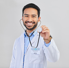 Image showing Doctor, man and listen with stethoscope in portrait with smile and cardiovascular health isolated on white background. Medical professional, happy male physician in studio and cardiology and surgeon