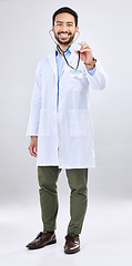 Image showing Doctor, man and listen with stethoscope, smile in portrait and cardiovascular health isolated on studio background. Medical professional, happy male physician with healthcare, cardiology and surgeon