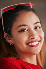 Image showing Happy, smile and closeup portrait of a woman in a studio with a positive, good and confident mindset. Happiness, excited and headshot of a female model from Brazil isolated by a brown background.