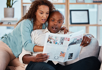 Image showing Shock, newspaper and couple reading in their home while relaxing in the living room on a sofa. Surprise, shocked and mature man and woman with a newsletter while sitting together in their apartment