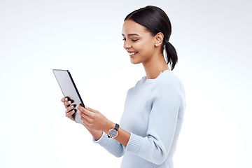 Image showing Woman, tablet and reading in studio by white background for planning, schedule and smile for website. Girl, student and excited on mobile touchscreen app for research, calendar or social network chat