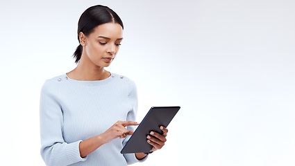 Image showing Woman, tablet and reading in studio by white background for planning, schedule and search on web app. Girl, student and typing on mobile touchscreen for research, calendar or studying by mockup space