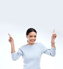 Image showing Mock up woman, portrait smile and pointing up at retail promo information, empty branding space or advertisement mockup. Direction, female presentation or studio model isolated on white background